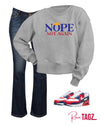 Gray unisex sweatshirt with bold phrase Nope Not Again printed on the front.  Cozy and perfect for making a subtle statement.