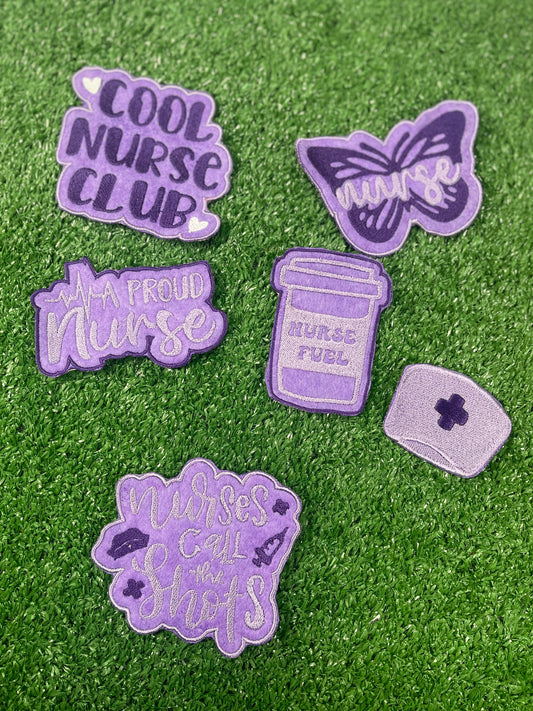 Purple nurse-themed embroidered iron-on patch set featuring six designs: 
Cool Nurse Club
A Proud Nurse
Nurse Fuel Coffee Cup
Nurse Cap 
Butterfly with Nurse script
Nurses Call the Shots phrase,
