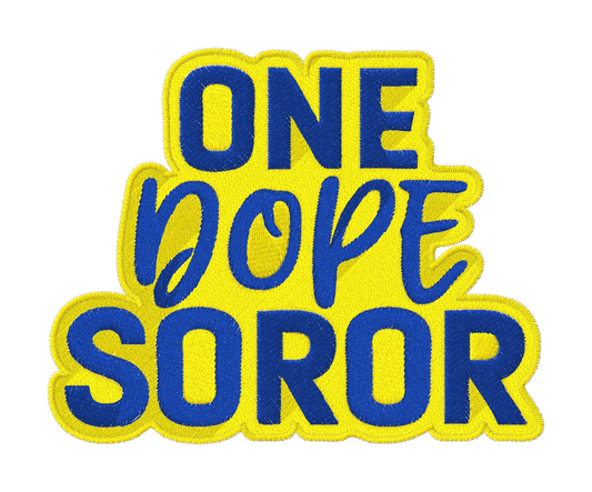 Embroidered patch with bold blue and yellow lettering that says One Dope Soror on a white background.