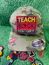 A vibrant, rectangular embroidered patch with the bold words Teach Black History in yellow, red, and green. The design features the outline of Africa within the word Black symbolizing pride, education, and cultural heritage.