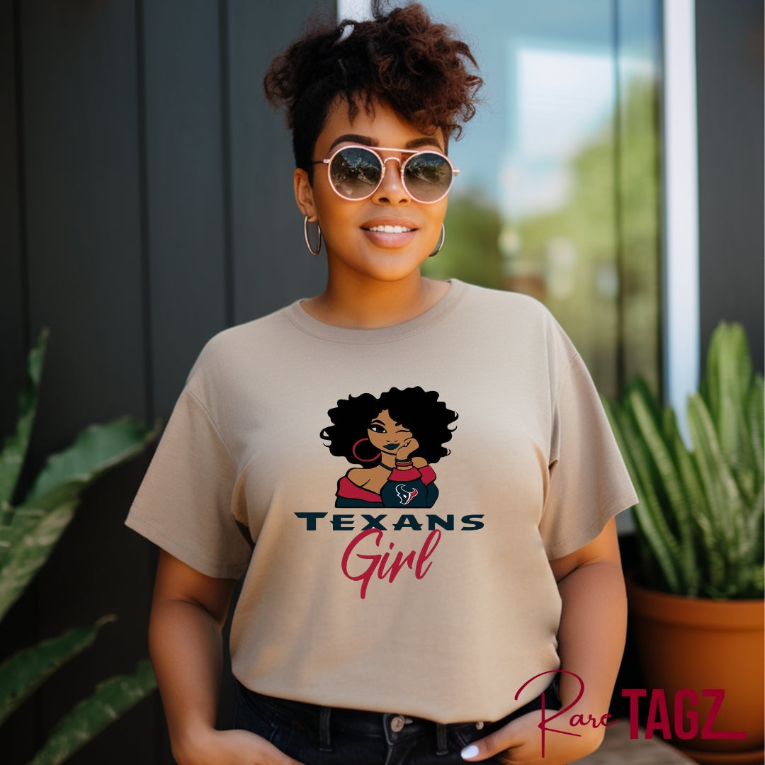 Stylish and comfortable t-shirt featuring a bold 'Texans Girl' graphic in vibrant colors. Made from a soft and durable cotton blend, this tee provides all-day comfort. It's perfect for proud Texas women who want to showcase their state pride in a fashionable way. The shirt pairs well with jeans, shorts, or skirts, making it ideal for casual outings and everyday wear. Available in various sizes to fit all body types, this Texans Girl T-Shirt is a must-have for any Texas enthusiast.