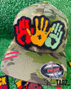 A vibrant embroidered patch featuring three overlapping handprints in red, yellow, green, symbolizing unity. pride, and heritage. The patch has a bold black outline that enhances the striking design. Perfect for celebrating Black culture and adding a meaningful touch to clothing or accessories.