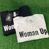 Woman Up T-Shirt. Each shirt features bold white or black lettering, emphasizing empowerment and confidence. Just in time for Women's History Month.