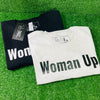 Woman Up T-Shirt. Each shirt features bold white or black lettering, emphasizing empowerment and confidence. Just in time for Women's History Month.