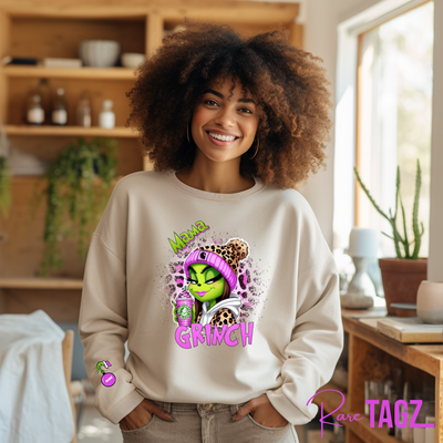 Customizable sweatshirt featuring a playful 'Mama Grinch' design. The sweatshirt can be personalized with the names of kids, making it a unique and festive piece. Perfect for moms looking to celebrate the holiday season with a touch of fun and personalization.